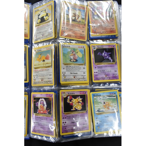 464 - FOLDER OF POKEMON CARDS, approximately 500 cards ranging from Base Set to Skyridge; includes holos, ... 