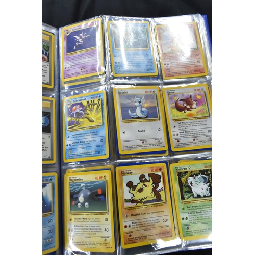 464 - FOLDER OF POKEMON CARDS, approximately 500 cards ranging from Base Set to Skyridge; includes holos, ... 