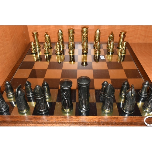 466 - A GOTHIC STYLE CHESS SET, complete, with metal pieces and oak bordered mirrored board, board measure... 