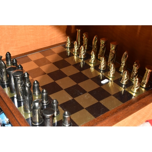 466 - A GOTHIC STYLE CHESS SET, complete, with metal pieces and oak bordered mirrored board, board measure... 