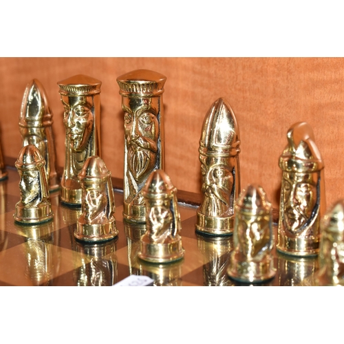 466 - A GOTHIC STYLE CHESS SET, complete, with metal pieces and oak bordered mirrored board, board measure... 