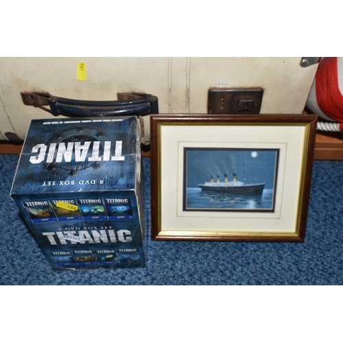 486 - A LARGE COLLECTION OF REPRODUCTION TITANIC MEMORABILIA, to include a framed model of the Titanic 56.... 