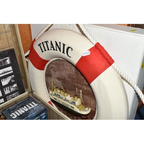 486 - A LARGE COLLECTION OF REPRODUCTION TITANIC MEMORABILIA, to include a framed model of the Titanic 56.... 