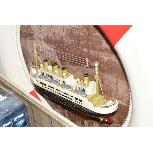 486 - A LARGE COLLECTION OF REPRODUCTION TITANIC MEMORABILIA, to include a framed model of the Titanic 56.... 