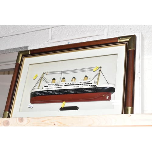 486 - A LARGE COLLECTION OF REPRODUCTION TITANIC MEMORABILIA, to include a framed model of the Titanic 56.... 