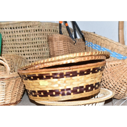 513 - A QUANTITY OF WICKER BASKETS AND TABLEWARE to include a Fenwick wicker hamper, a wicker handbag, fou... 