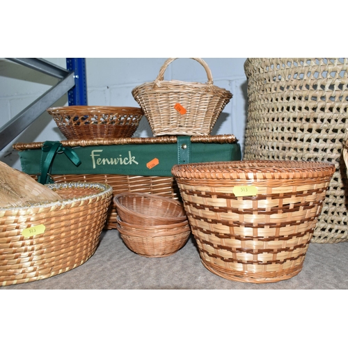 513 - A QUANTITY OF WICKER BASKETS AND TABLEWARE to include a Fenwick wicker hamper, a wicker handbag, fou... 