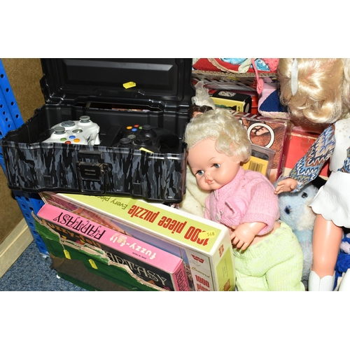 548 - FIVE BOXES OF SOFT TOYS, DOLLS AND BOOKS, to include a collection of vintage jigsaws, Warner Brother... 