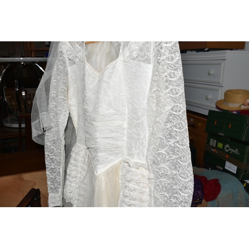 551 - A 1950S WEDDING DRESS AND SHOES, a  long sleeved 1950s wedding dress, approximate size 8/10 and a la... 