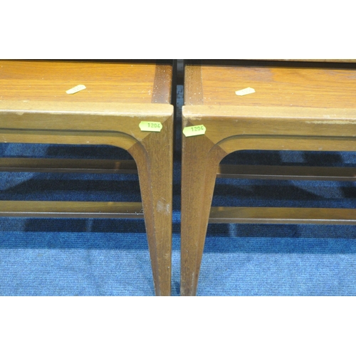 1204 - A MID CENTURY TEAK NEST OF THREE TABLES, largest table width 99cm x depth 43cm x height 42cm, along ... 