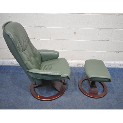 1206 - A GREEN LEATHER SWIVEL RECLINING ARMCHAIR, along with a footstool (condition report: general signs o... 