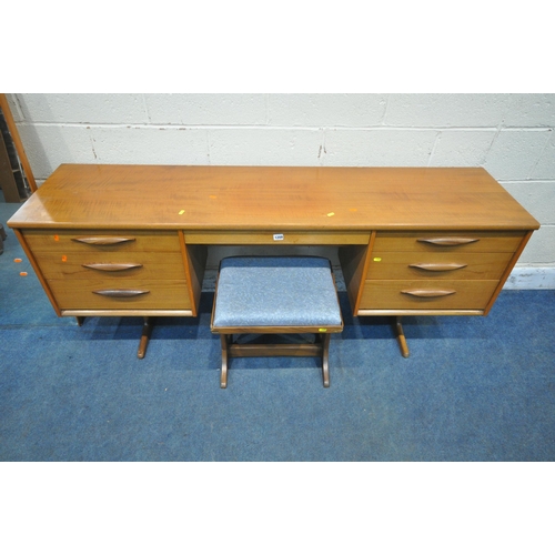 1209 - AN AUSTINSUITE MID CENTURY TEAK DRESSING TABLE, with a rectangular mirror, fitted with seven drawers... 