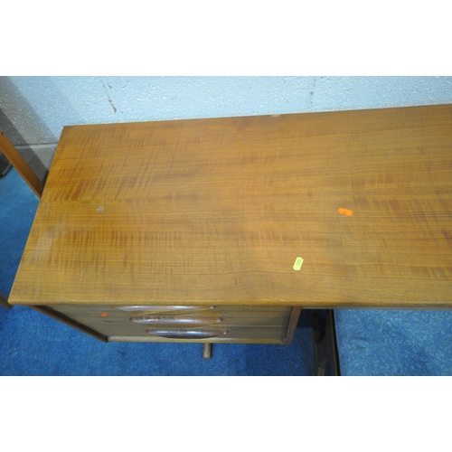 1209 - AN AUSTINSUITE MID CENTURY TEAK DRESSING TABLE, with a rectangular mirror, fitted with seven drawers... 