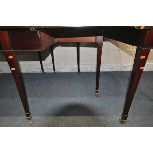 1217 - A GEORGIAN MAHOGANY OVAL DINING TABLE, that consists of two D-end tables and a central drop leaf tab... 