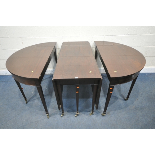 1217 - A GEORGIAN MAHOGANY OVAL DINING TABLE, that consists of two D-end tables and a central drop leaf tab... 