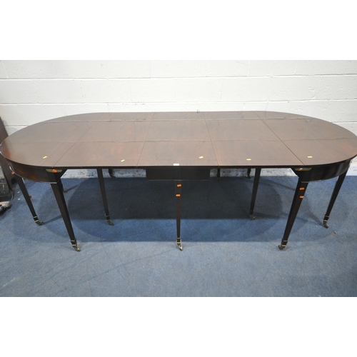 1217 - A GEORGIAN MAHOGANY OVAL DINING TABLE, that consists of two D-end tables and a central drop leaf tab... 