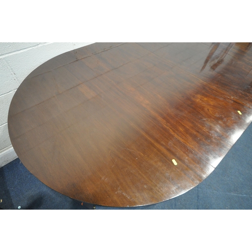 1217 - A GEORGIAN MAHOGANY OVAL DINING TABLE, that consists of two D-end tables and a central drop leaf tab... 