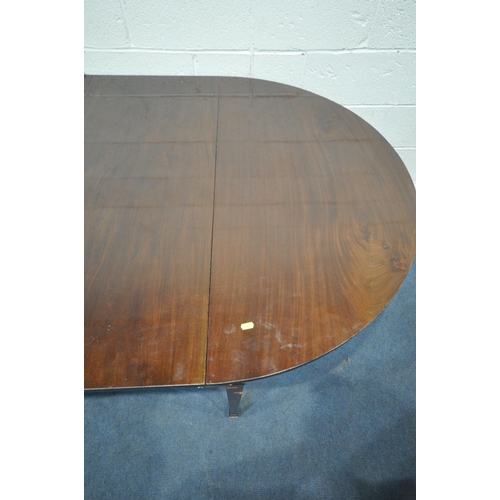 1217 - A GEORGIAN MAHOGANY OVAL DINING TABLE, that consists of two D-end tables and a central drop leaf tab... 