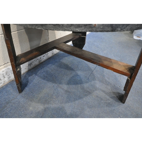 1222 - AN OAK AND METAL BANDED BARREL PUB TABLE, raised on three legs, united by stretchers, diameter appro... 