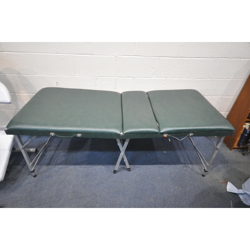 1230 - A GREEN FOLDING MASSAGE BED, with height adjustable legs and headrest, along with a white massage ch... 