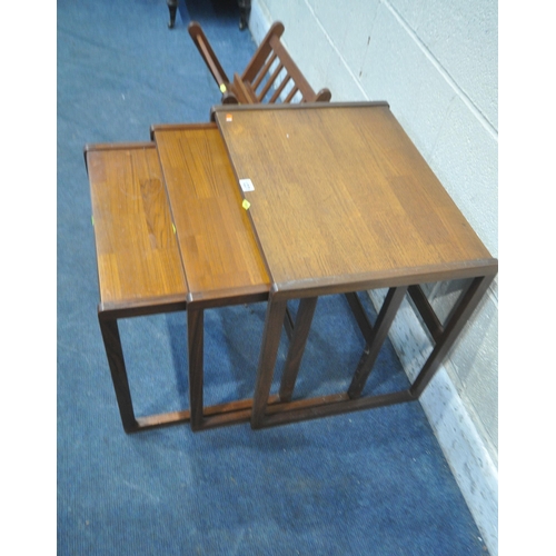 1231 - G-PLAN, A MID CENTURY TEAK NEST OF THREE TABLES, with a brick pattern top, largest table width 57cm ... 