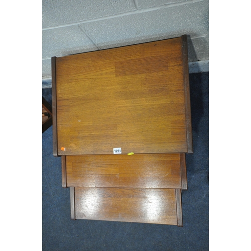 1231 - G-PLAN, A MID CENTURY TEAK NEST OF THREE TABLES, with a brick pattern top, largest table width 57cm ... 