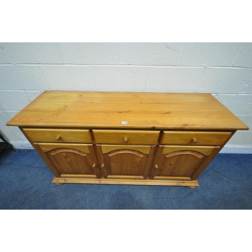 1236 - A MODERN PINE SIDEBOARD, fitted with three drawers above three cupboard doors, length 150cm x depth ... 