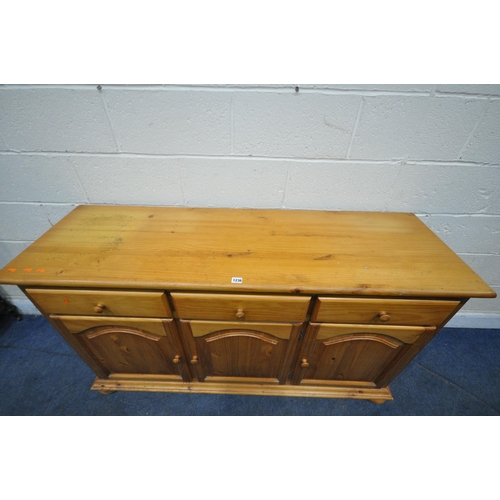 1236 - A MODERN PINE SIDEBOARD, fitted with three drawers above three cupboard doors, length 150cm x depth ... 