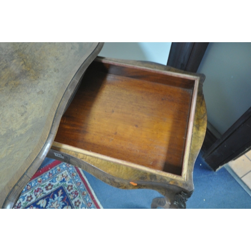 1243 - A 19TH CENTURY FRENCH BURR WALNUT GAMES TABLE, the serpentine revolving fold over top enclosing a gr... 