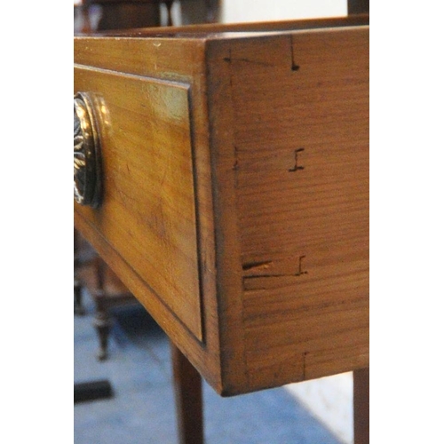 1244 - AN EARLY 20TH CENTURY MAHOGANY DRESSING TABLE, with an oval bevelled edge mirror, four drawers, rais... 