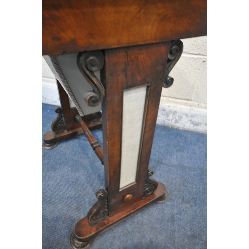 1249 - A REGENCY FLAME MAHOGANY WORK TABLE, the fold over top encloses a blue leather writing surface, sing... 