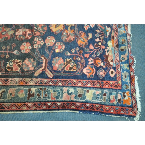 1265 - A PERSIAN SUMAK RUG, with a diagonal stripped pattern, within a different field, and a multi strap b... 