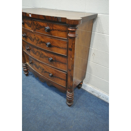 1266 - A VICTORIAN FLAME MAHOGANY BOWFRONT SCOTTISH CHEST, with rounded front corners, octagonal pillars, f... 