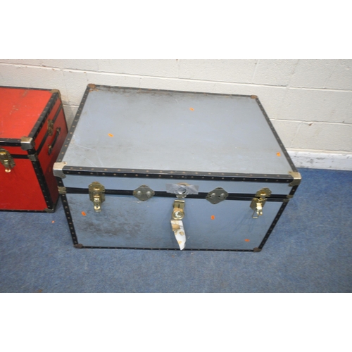 1267 - A LARGE GREY TRAVELING TRUNK, width 101cm x depth 75cm x height 57cm, along with a smaller red trunk... 