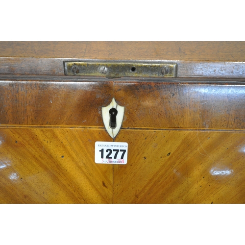 1277 - A GEORGIAN FLAME MAHOGANY BUREAU, the fall front door enclosing a fitted interior, above four long d... 