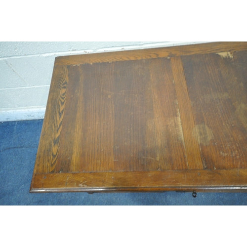 1278 - AN EARLY 20TH CENTURY OAK BLANKET CHEST, with a hinged lid, raised on bun feet, width 106cm x depth ... 