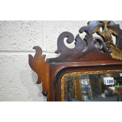 1280 - A 19TH CENTURY MAHOGANY FRETWORK BEVELLED EDGE WALL MIRROR, the crest depicting a majestic bird, the... 