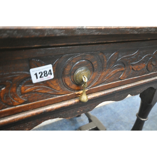 1284 - AN OAK JACOBEAN STYLE SIDE TABLE, with canted front corners, a single frieze drawer, raised on block... 