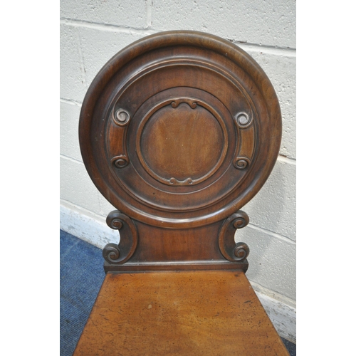 1288 - A PAIR OF VICTORIAN MAHOGANY HALL CHAIRS, with an oval back rest, raised on turned and tapered front... 