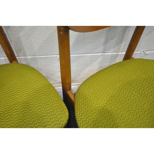 1295 - A SET OF FOUR MID CENTURY TEAK DINING CHAIRS, with rounded back rest, green upholstery, raised on cy... 