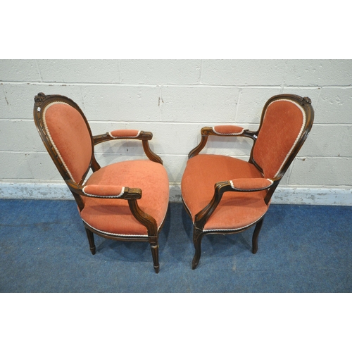 1297 - TWO OAK FRAMED FRENCH ARMCHAIRS, both with open armrests, one raised on cabriole front legs, the oth... 