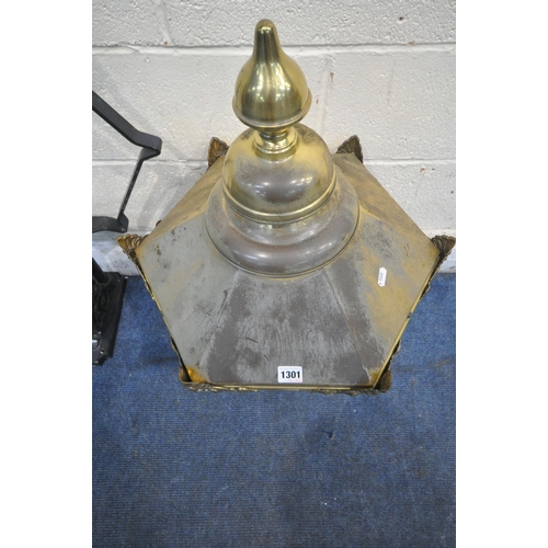 1301 - A BRASS HEXAGONAL TAPERED WALL HANGING LANTERN, with a finial and metal bracket, height approximatel... 