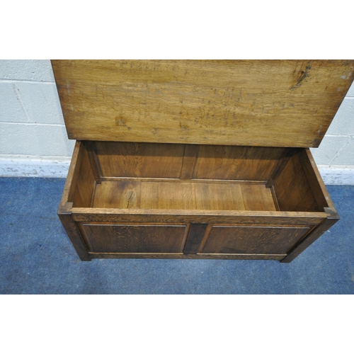 1305 - TERRY 'RAM MAN' HARRINGTON, A SOLID OAK HALL SETTLE, with a hinged seat, width 106cm x depth 48cm x ... 