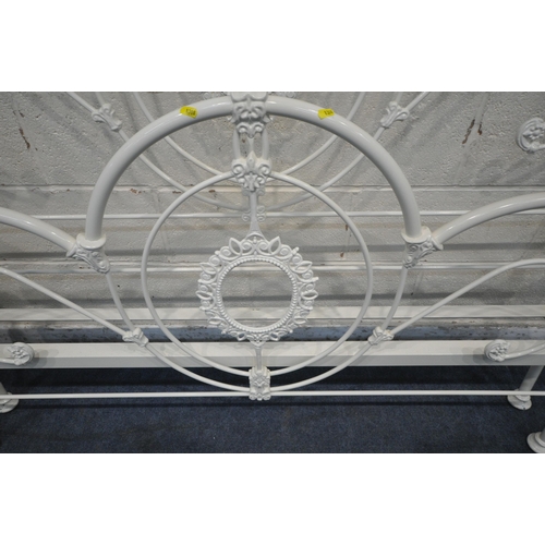 1308 - A WHITE PAINTED TUBULAR METAL 4FT6 BEDSTEAD, with side rails, slats and central support (condition r... 