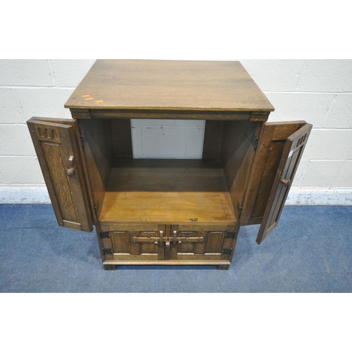 1313 - A LATE 20TH CENTURY OAK MEDIA CABINET, with double bi-fold doors, above two cupboard doors, width 74... 