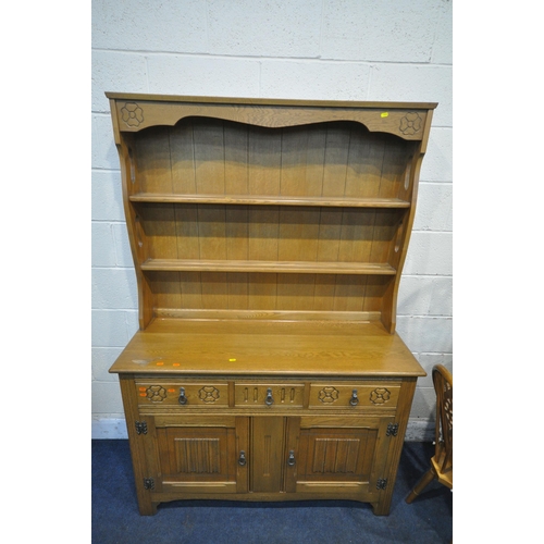 1314 - A LATE 20TH CENTURY OAK DROP LEAF DINING TABLE, raised on trestle legs, diameter 121cm x closed widt... 