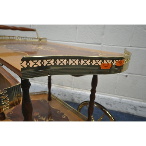 1316 - AN ITALIAN TWO TEIR DROP LEAF TEA TROLLEY, with raised gallery, a single handle, raised on turned su... 