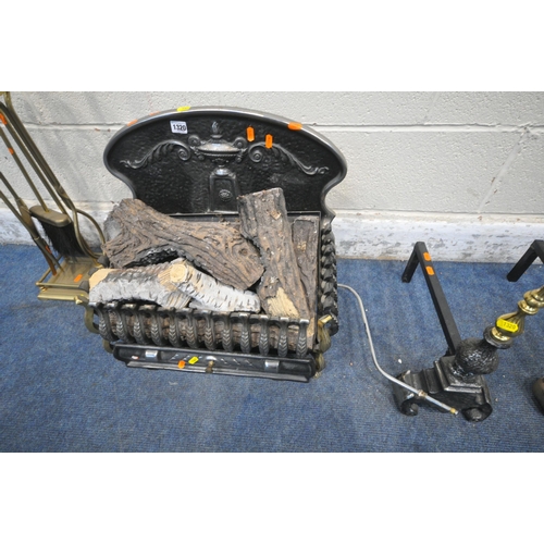 1320 - A LOG EFFECT GAS HEATER, a pair of cast iron andirons, with brass finials, along with a brass compan... 