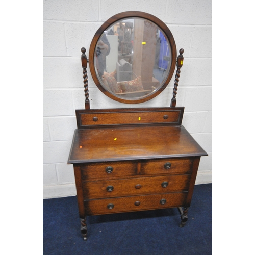 1338 - AN EARLY 20TH CENTURY OAK DRAW LEAF DINING TABLE, raised on bulbous supports, shaped feet, united by... 