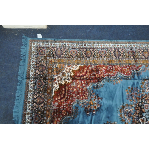 1345 - A LARGE RECTANGULAR BLUE AND RED WOOLEN TUNISIAN RUG, with repeating patterns and multi-strap border... 